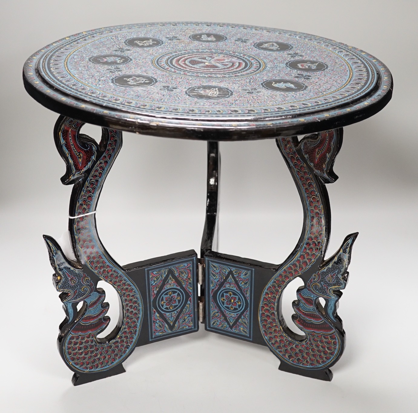 A Burmese lacquered dish and stand, 38cm tall
